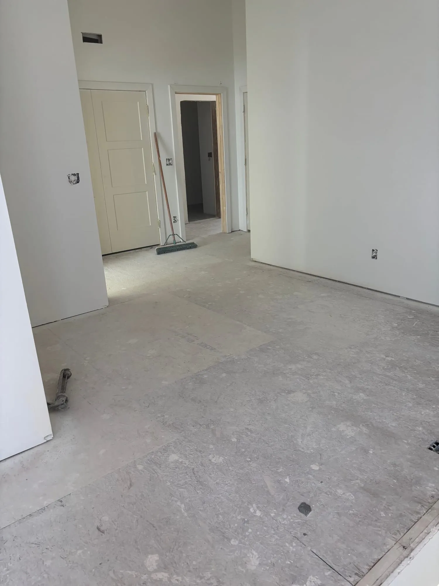 Swept and finished new-construction interior after a cleaning